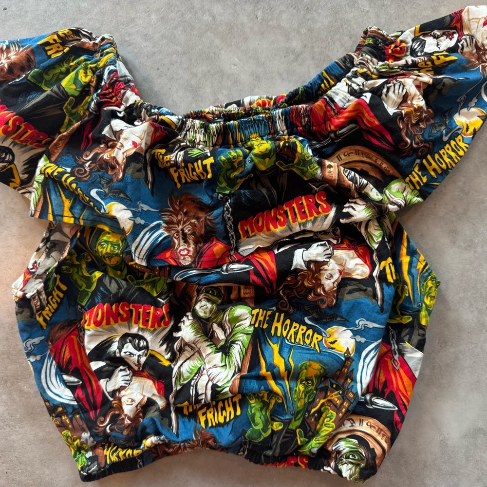 The Monsters Print Off-Shoulder Top